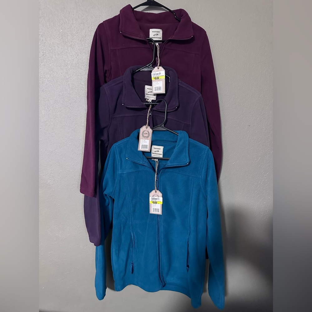 Fleece zip-up jackets. New with tags. Sold as lot.